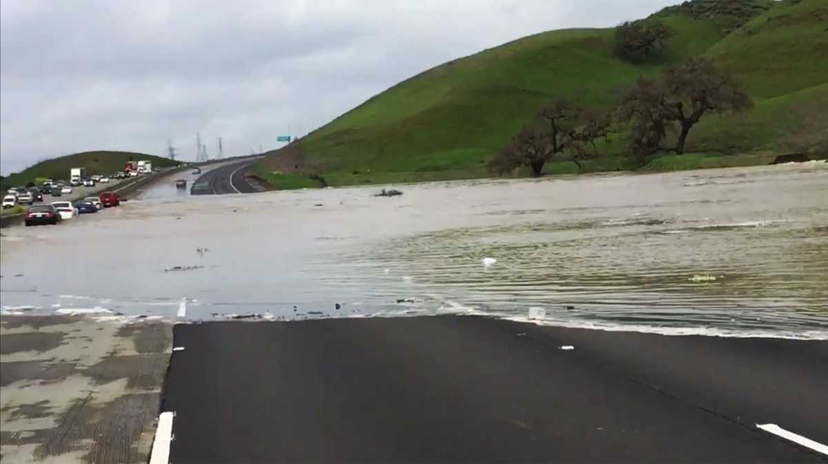 Coyote Creek overflows onto Highway 101 in Morgan Hill