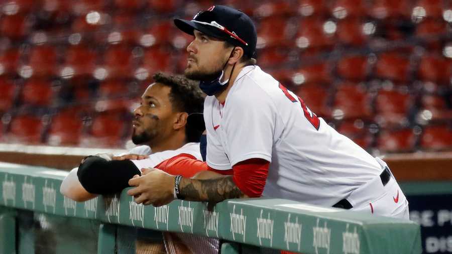 Boston Red Sox's Michael Chavis, right, and Xander Bogaerts watch the final fly out by Jackie Bradley Jr., giving the Toronto Blue Jays the win, during the ninth inning of a baseball game, Saturday, Aug. 8, 2020, in Boston. (AP Photo/Michael Dwyer)