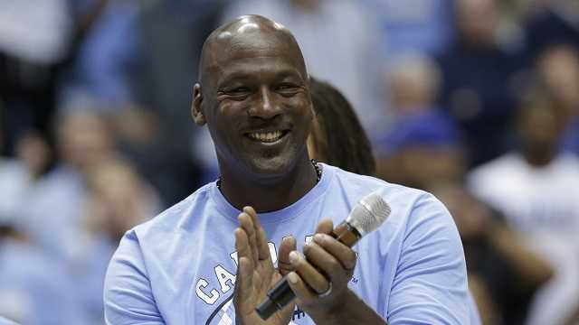 Former North Carolina basketball player Michael Jordan applauds during a half-time presentation in an NCAA college basketball game between North Carolina and Duke in Chapel Hill, N.C., Saturday, March 4, 2017.
