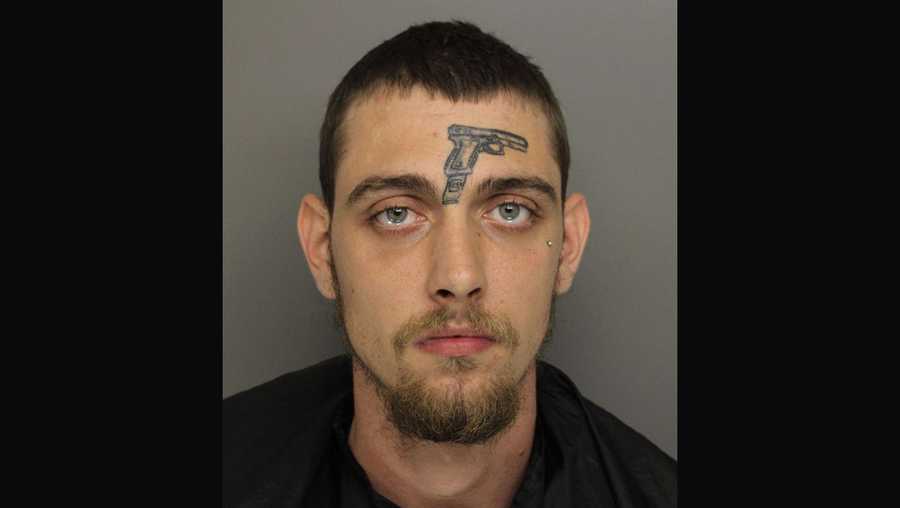 man with gun tattoo on forehead arrested on gun charge in greenville