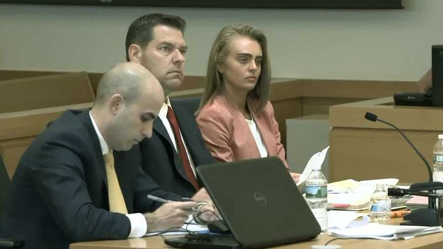 Michelle Carter sits with her lawyers in the courtroom