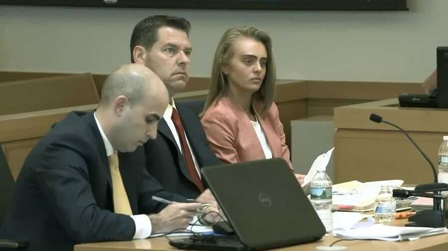 Michelle Carter sits with her lawyers in the courtroom