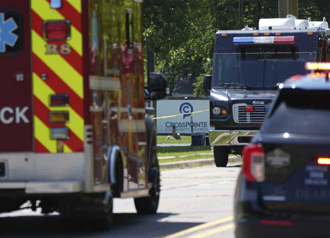 Emergency vehicles gather near CrossPointe Community Church in Wayne, Mich., Sunday, June 23, 2025.