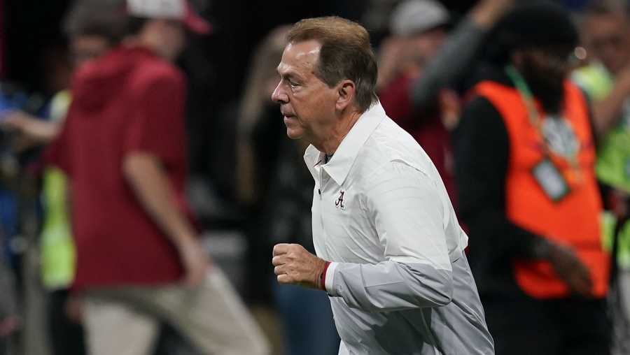 Alabama head coach Nick Saban runs onto the field before the Southeastern Conference championship NCAA college football game against Georgia in Atlanta, Saturday, Dec. 2, 2023. (AP Photo/Mike Stewart)
