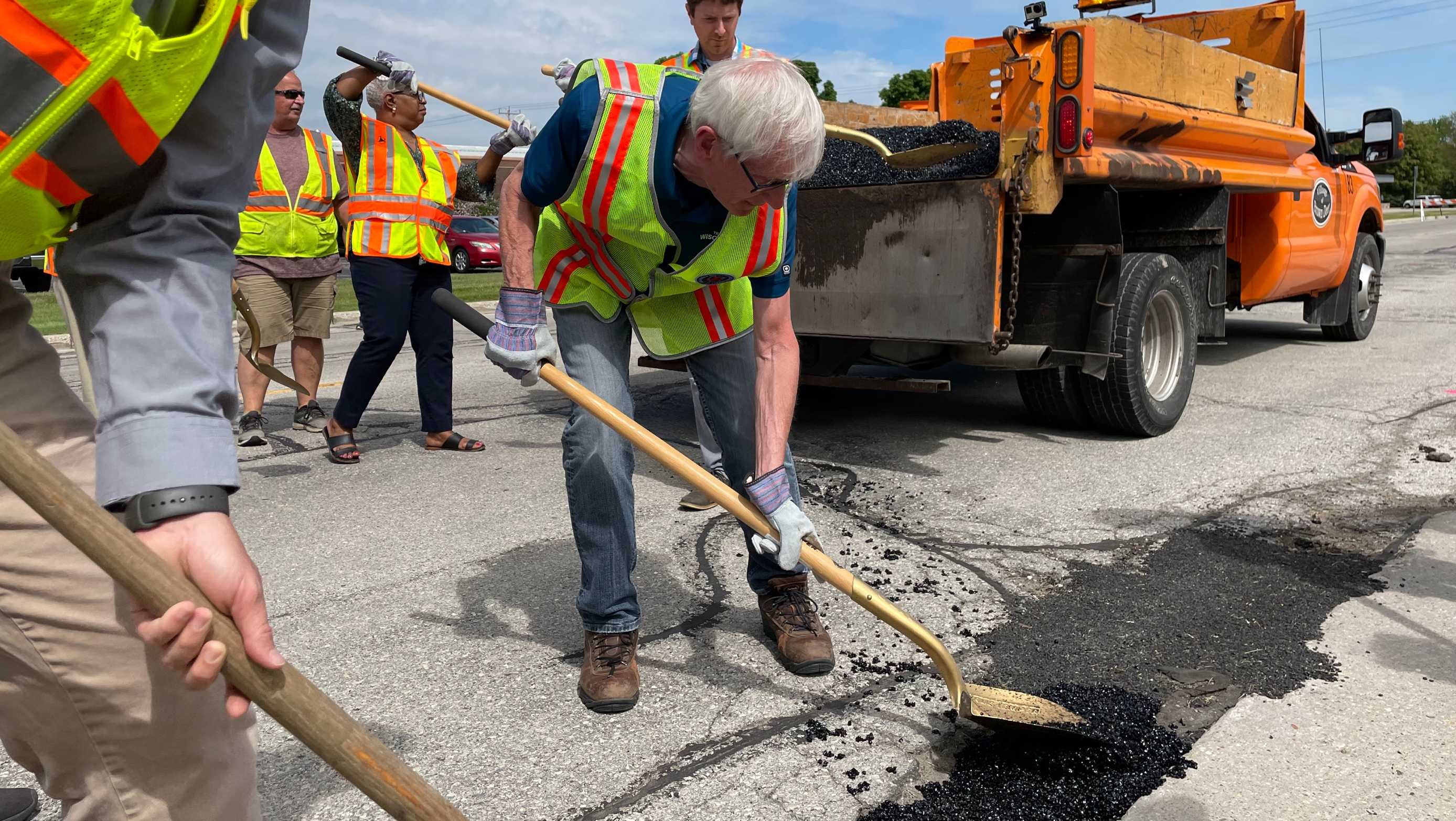 Wisconsin Gov. Tony Evers fills in potholes