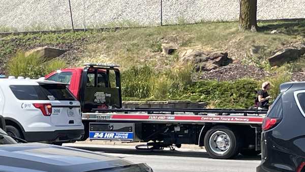 A bike was trapped under a truck in Des Moines following a crash.