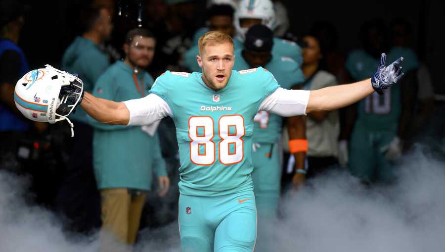 Miami Dolphins tight end Mike Gesicki (88) gestures as he is introduced to the fans before an NFL football game against the New York Jets, Sunday, Jan. 8, 2023, in Miami Gardens, Fla. (AP Photo/Doug Murray)