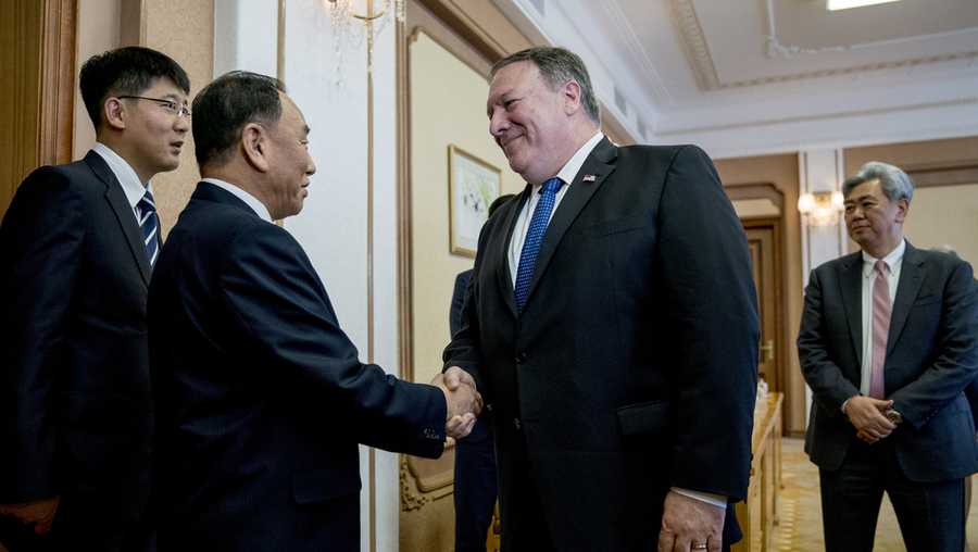 U.S. Secretary of State Mike Pompeo, second from right, greets Kim Yong Chol, second from left, a North Korean senior ruling party official and former intelligence chief, as they arrive for a meeting at the Park Hwa Guest House in Pyongyang, North Korea, Friday, July 6, 2018.