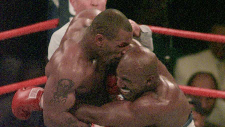 Mike Tyson bites into the ear of Evander Holyfield in the third round of their WBA Heavyweight match Saturday, June 28, 1997, at the MGM Grand in Las Vegas. 