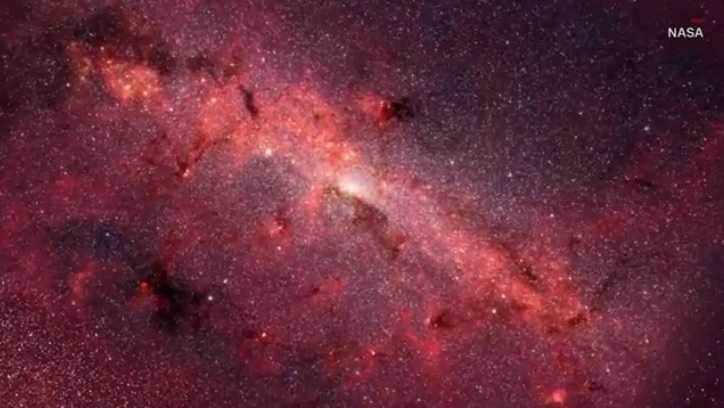 Scientists say the galaxy collided with a smaller one, setting off billions of years of star formations.