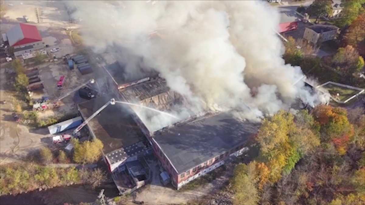 Massive mill fire smolders day after, slowing investigation