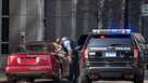 A Minneapolis Police officer checks a suspicious car without a plate parked near the Hennepin County Government Center as the jury selection begins at the trial of former police officer Derek Chauvin in Minneapolis, Minnesota on March 9, 2021. 