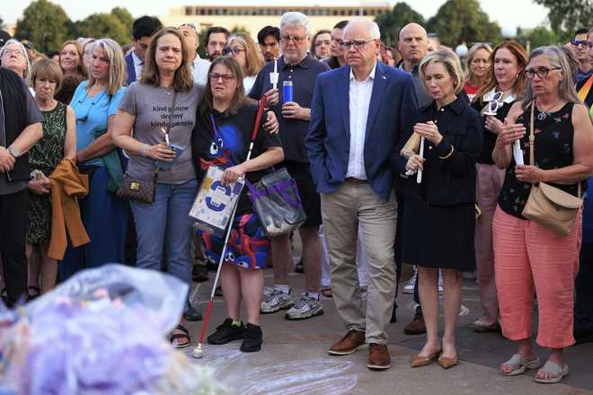 Minnesota&#x20;Gov.&#x20;Tim&#x20;Walz&#x20;and&#x20;his&#x20;wife&#x20;Gwen&#x20;Walz&#x20;attend&#x20;a&#x20;candlelight&#x20;vigil&#x20;for&#x20;former&#x20;House&#x20;Speaker&#x20;Melissa&#x20;Hortman&#x20;and&#x20;her&#x20;husband,&#x20;Mark,&#x20;at&#x20;the&#x20;State&#x20;Capitol,&#x20;Wednesday,&#x20;June&#x20;18,&#x20;2025,&#x20;in&#x20;St.&#x20;Paul,&#x20;Minn.