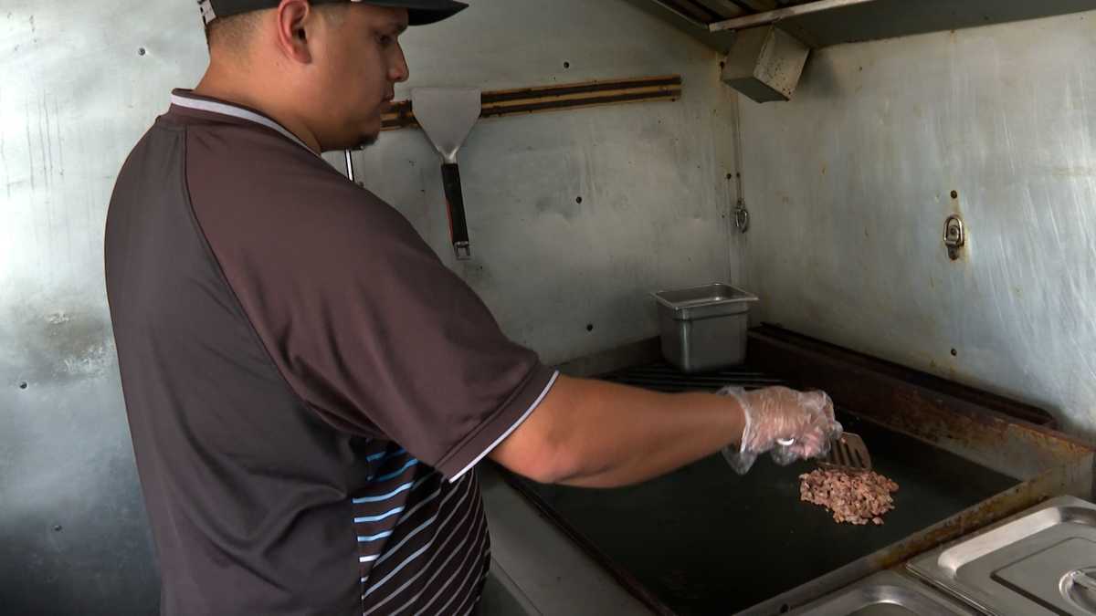 Food truck workers braving the hear while cooking up business