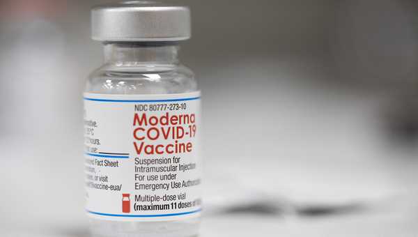 FILE - A vial of the Moderna COVID-19 vaccine is displayed on a counter at a pharmacy in Portland, Ore. on Dec. 27, 2021.