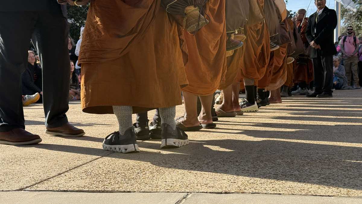 Barefoot monks on a "Walk for Peace" rest in Pearl