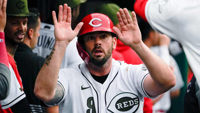 cincinnati reds' mike moustakas celebrates with teammates after scoring on a two-run single by kyle farmer during the first inning of the team's baseball game against the pittsburgh pirates in cincinnati on friday, aug. 6, 2021. (ap photo/jeff dean)