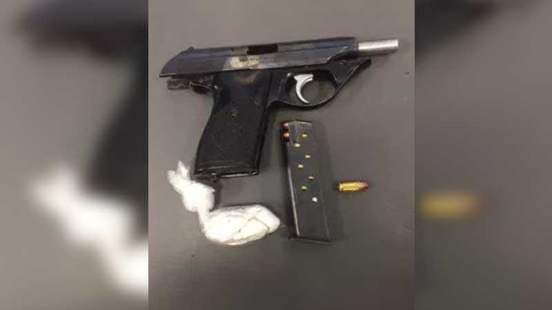 Gang unit finds loaded gun, suspected opioids