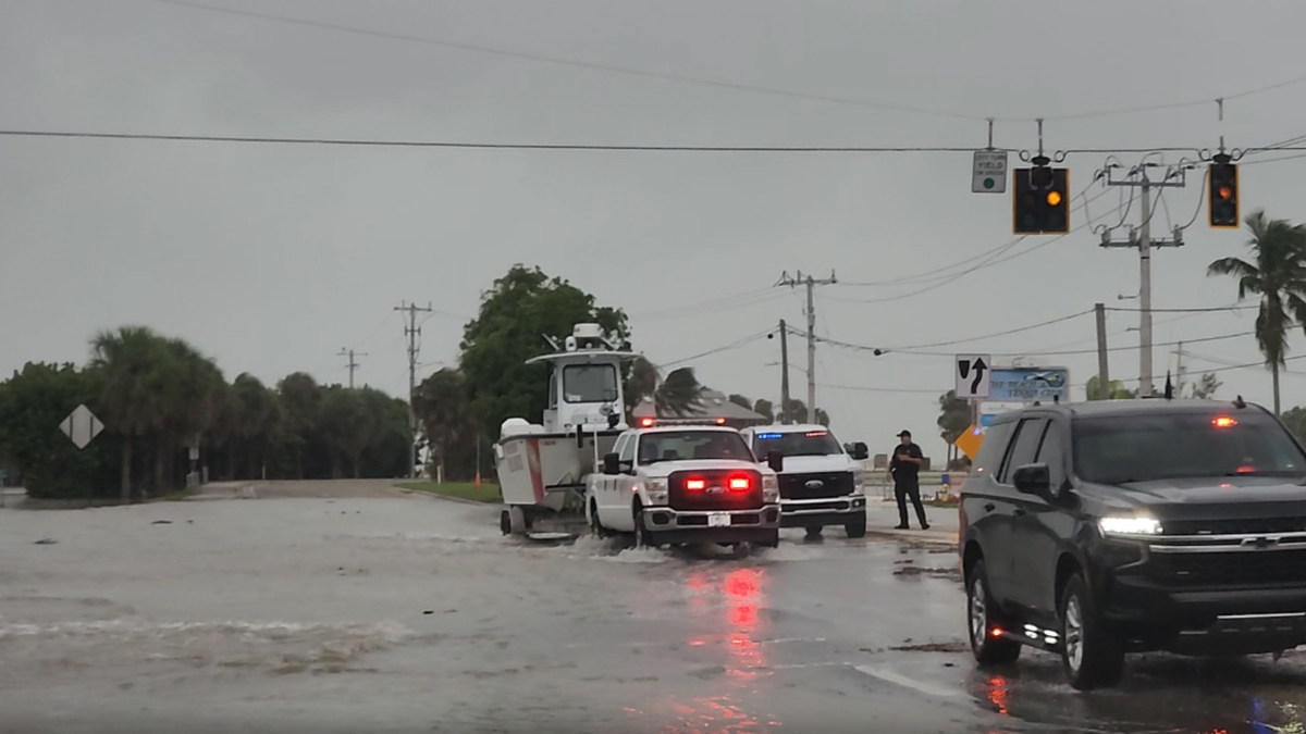 Storm surge rushes onto Bonita Beach Road