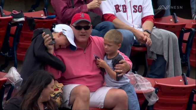 Young Red Sox fan beside himself after little brother throws foul