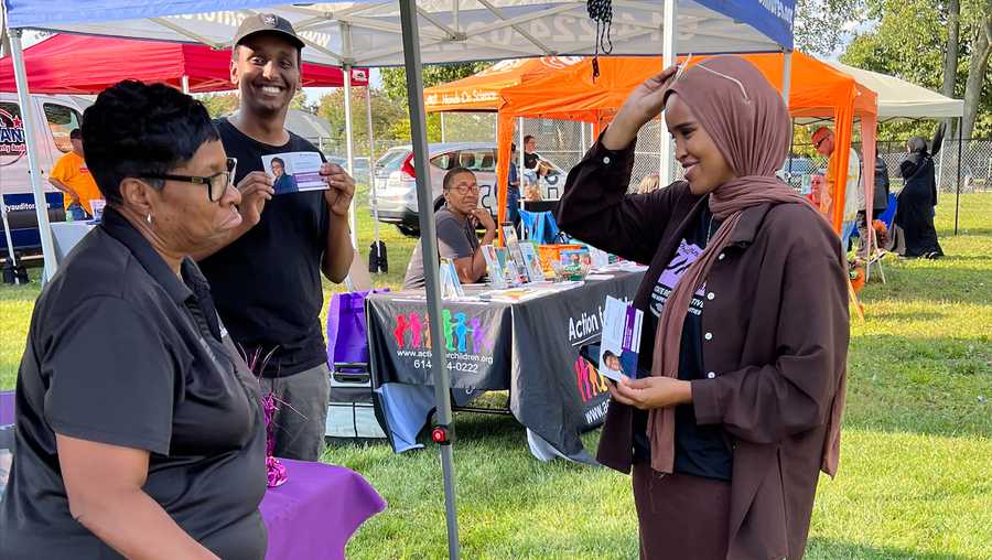 FILE - In this undated photo provided by Munira Abdullahi, right, the Democratic candidate running unopposed for the Ohio House of Representatives chats with potential voters in her home city of Columbus, Ohio. The 26-year-old is all but guaranteed to become the first Somali woman and Muslim woman to serve in the Ohio Legislature. Columbus is home to the second-largest Somali population in the United States. (Munira Abdullahi via AP, File)