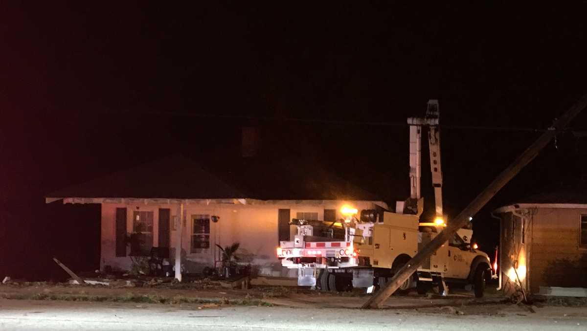Car crashes into home's porch, utility pole