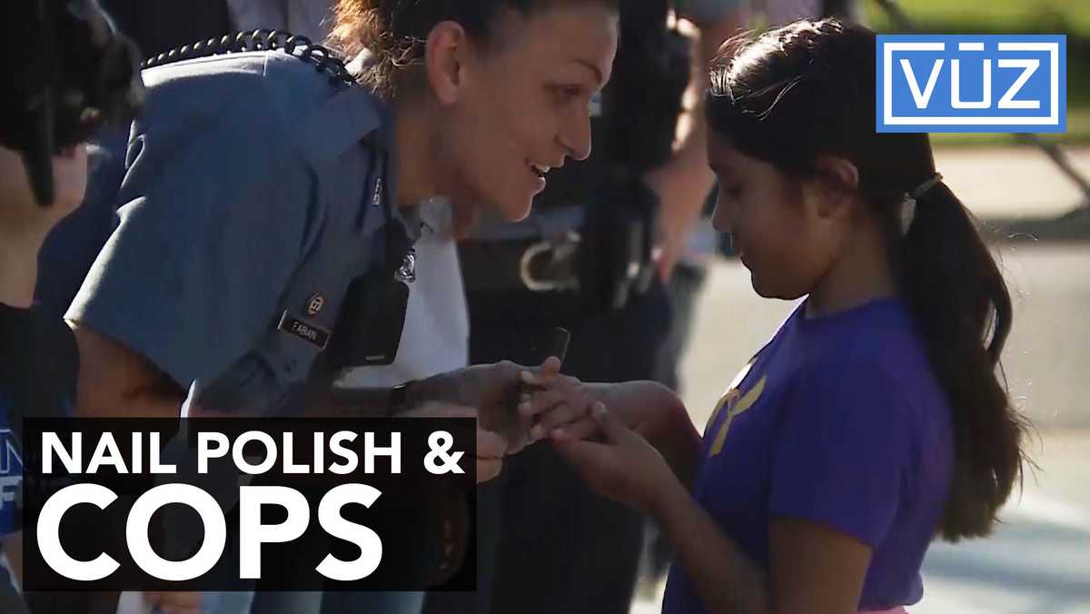 Police officers use nail polish to encourage girls