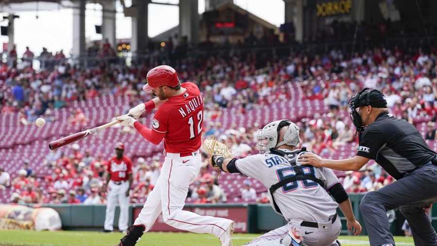 cincinnati reds' tyler naquin (12) hits a solo home run during the sixth inning of a baseball game against the miami marlins, thursday, july 28, 2022, in cincinnati. (ap photo/jeff dean)