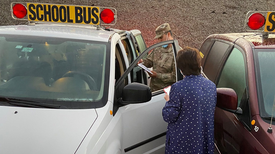 national guard member prepares to drive school van in worcester