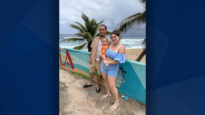 Damian Rodriguez with fiancee and son