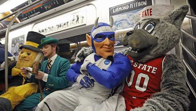 The mascots of Wake Forest, Notre Dame, Duke and North Carolina State share a subway ride in New York City on March 6, 2017. 