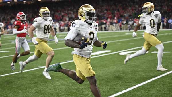 Notre Dame's Jayden Harrison (2) returns a kickoff 98 yards for a touchdown during the second half against Georgia in the quarterfinals of a College Football Playoff, Thursday, Jan. 2, 2025.