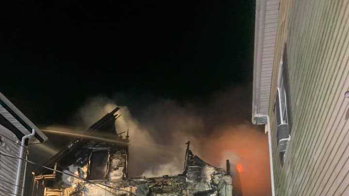 Suspicious fire rips through unoccupied New Bedford home