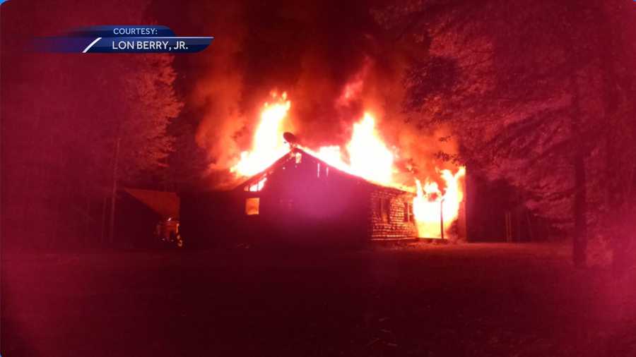 Fire burns log cabin in New Durham