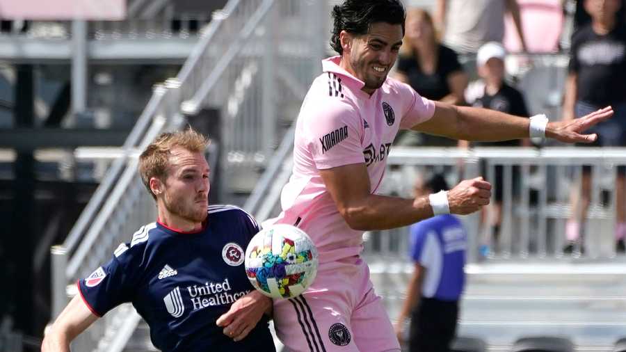 New England Revolution defender Henry Kessler, left, and Inter Miami forward Leonardo Campana go for the ball during the first half of an MLS soccer match, Saturday, April 9, 2022, in Fort Lauderdale, Fla.