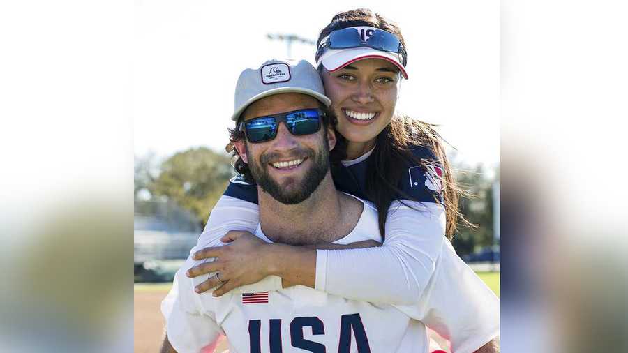 In this photo provided by USA Softball, Jake and Janie Reed pose for a photo in Clearwater, Fla., in February 2020. (Jade Hewitt/Courtesy of USA Softball)