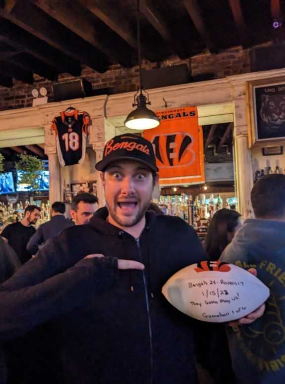 Bengals coach Zac Taylor delivers game ball to fans at a bar