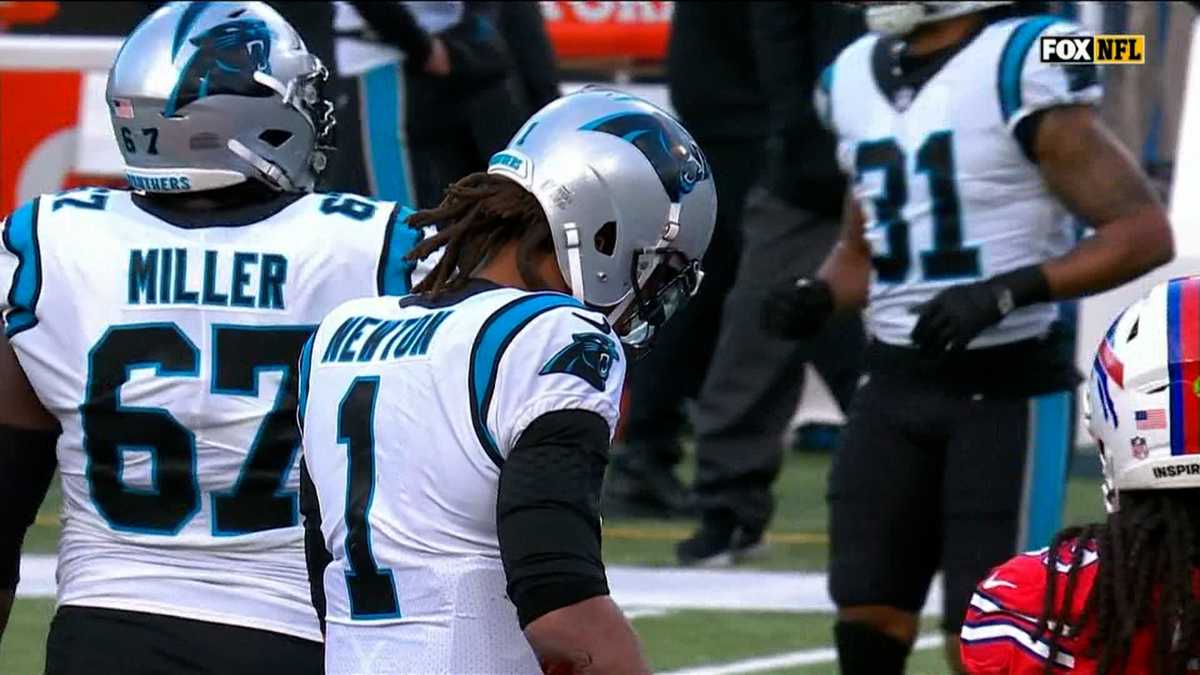 Cam Newton of the Carolina Panthers is sacked by Efe Obada of the