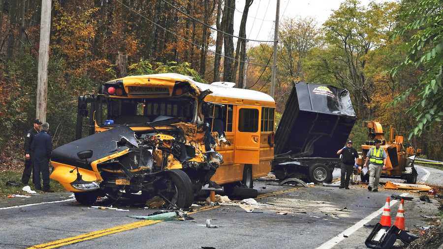 Law enforcement personnel work at the scene of a crash involving a school bus in New Windsor, N.Y. Wednesday, Oct. 21, 2020.