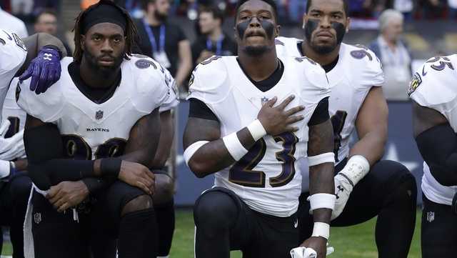 PHOTOS: NFL Players Kneel To Protest Trump's Remarks