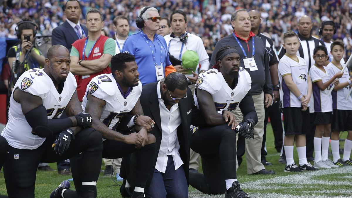 PHOTOS NFL players kneel to protest Trump's remarks