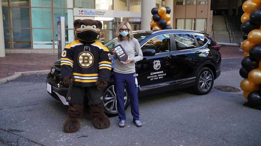 Tufts Medical Center nurse Kaitlin Hagstrom with car donated by David Pastrnak