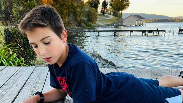 nick parcus admires his 70 pound catch