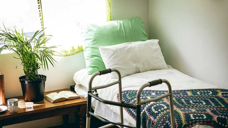Bedroom in a nursing home, bed, walker
