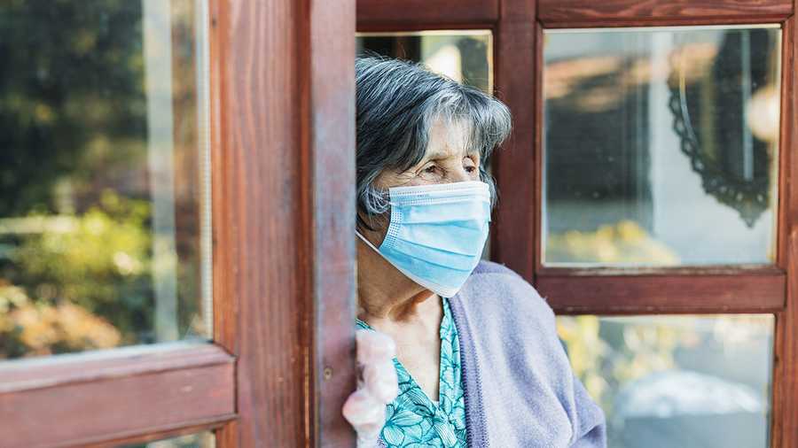 Senior woman with facial mask,Covid 19.