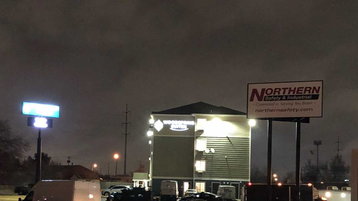 Suspect at large, two arrested after motel-room standoff