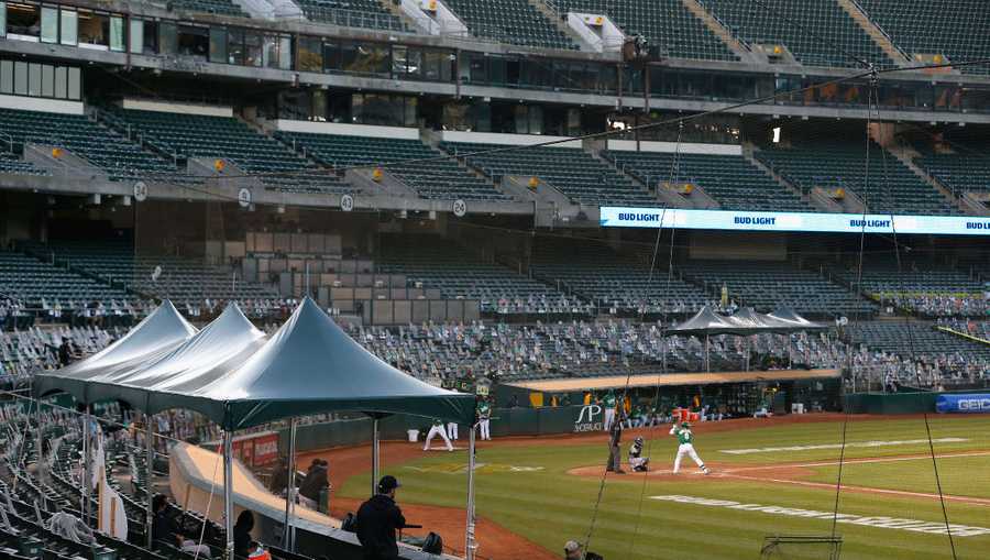 A general view of home plate and the benches during the game between the Colorado Rockies and the Oakland Athletics at Oakland-Alameda County Coliseum on July 28, 2020 in Oakland, California.