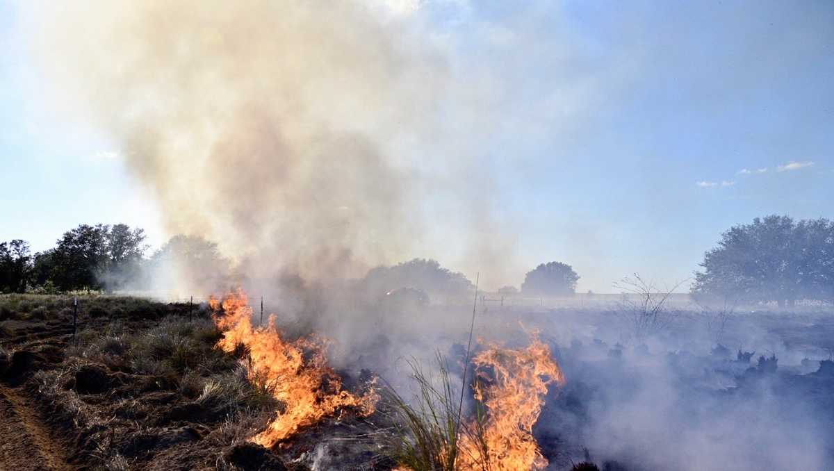 Firefighters battle brush fire near Lake and Orange County line