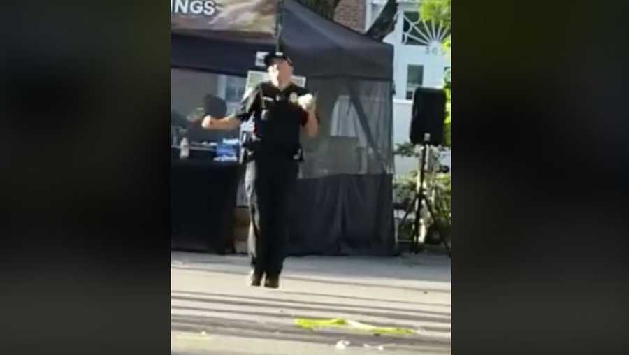 Officer dances at Rice Festival 