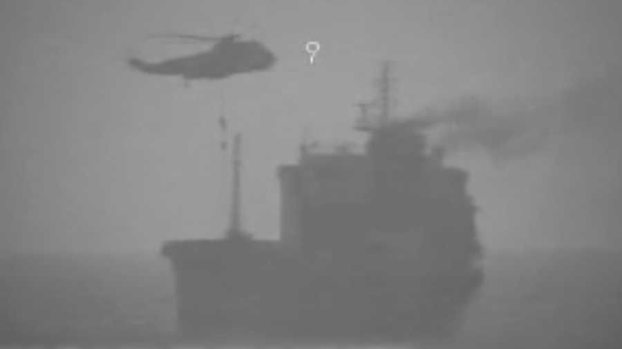 In this image made from video released by the U.S. military's Central Command, Iranian commandos fast-rope down from a helicopter onto the MV Wila oil tanker in the Gulf of Oman off the coast of the United Arab Emirates on Wednesday, Aug. 12, 2020.